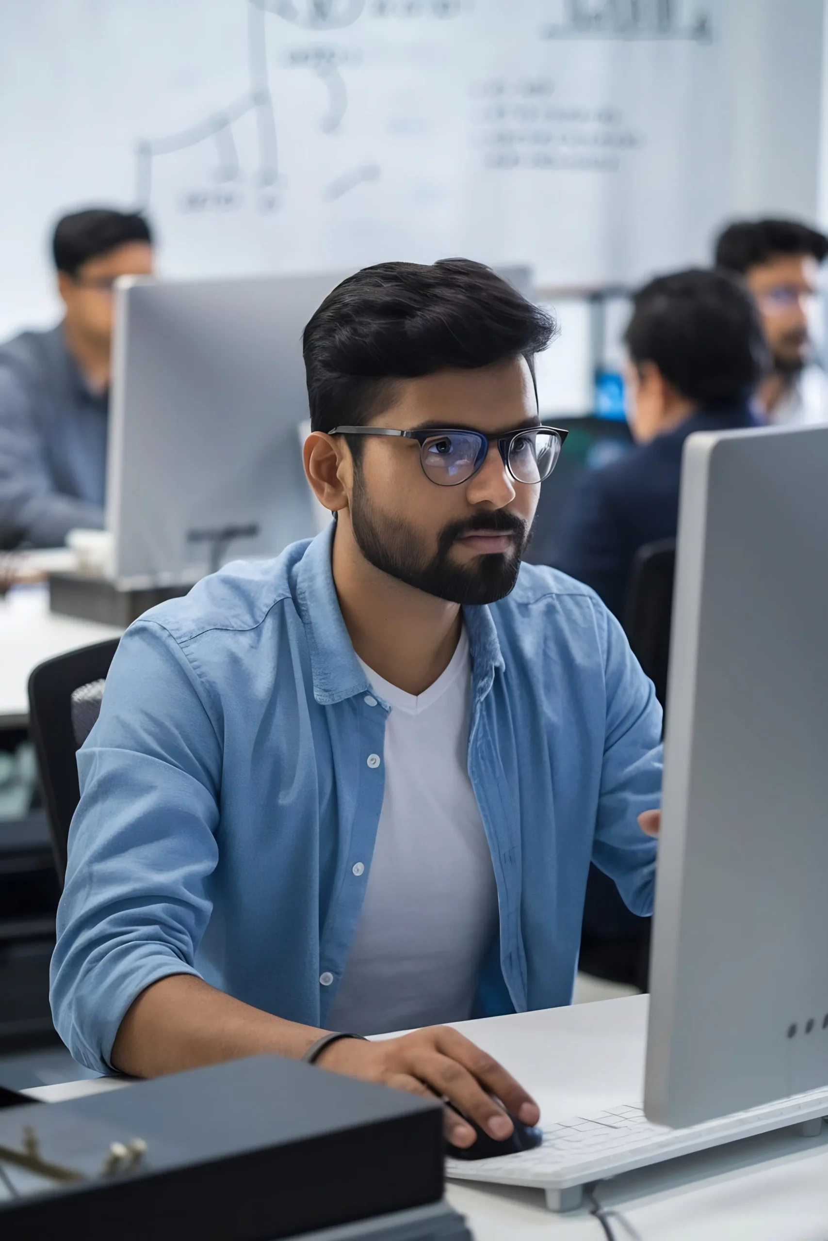 portrait-indian-happy-businessman-using-laptop-computer-office copy