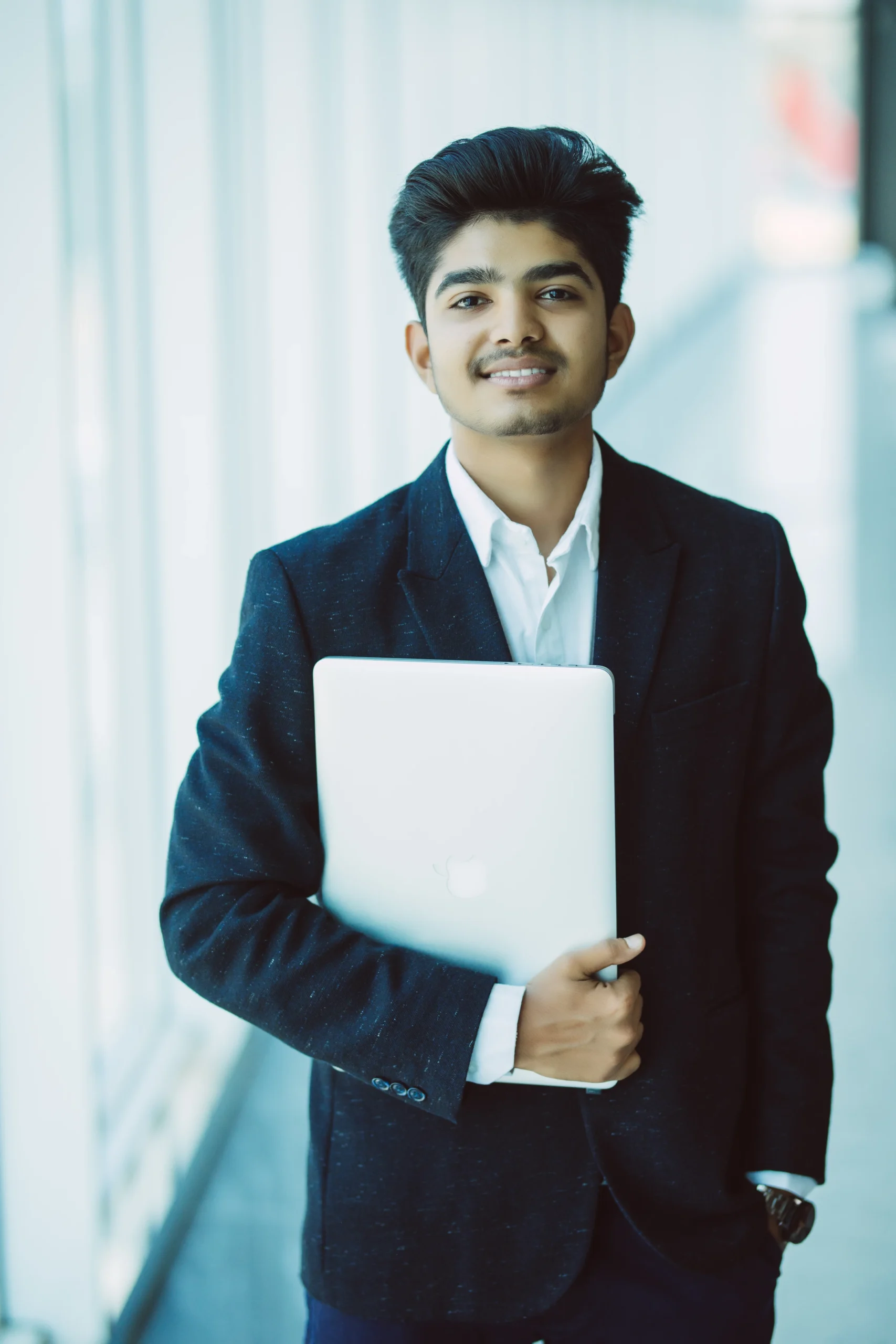 portrait-indian-happy-businessman-using-laptop-computer-office